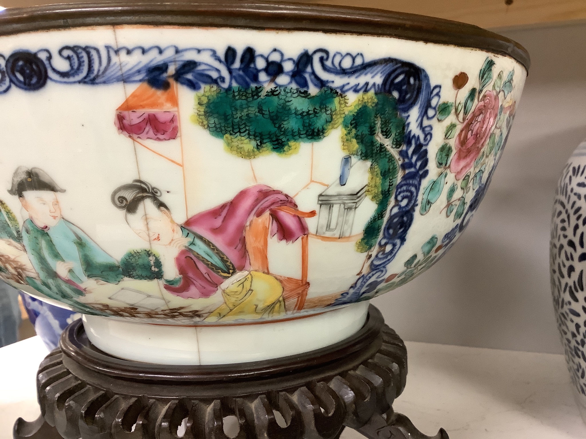 A 19th century Chinese porcelain prunus jar and cover, 27cm, on carved wood stand, a smaller famille noire jar and cover, a Chinese export fruit bowl, blue and white dish and a similar jar and cover 27cm